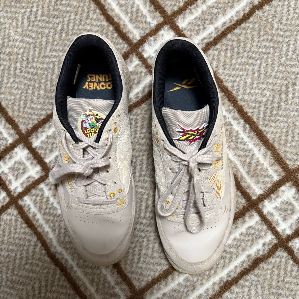 Reebok Cream and Black Cartoon Sneakers